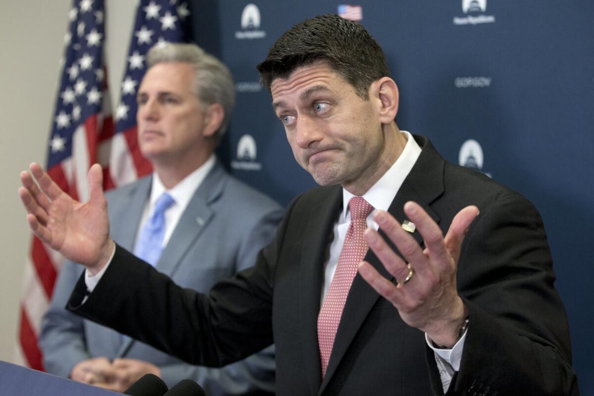 Speaker of the House Republican Paul Ryan (R-Wis.) gestures during a news conference beside House Majority Leader Republican Kevin McCarthy.