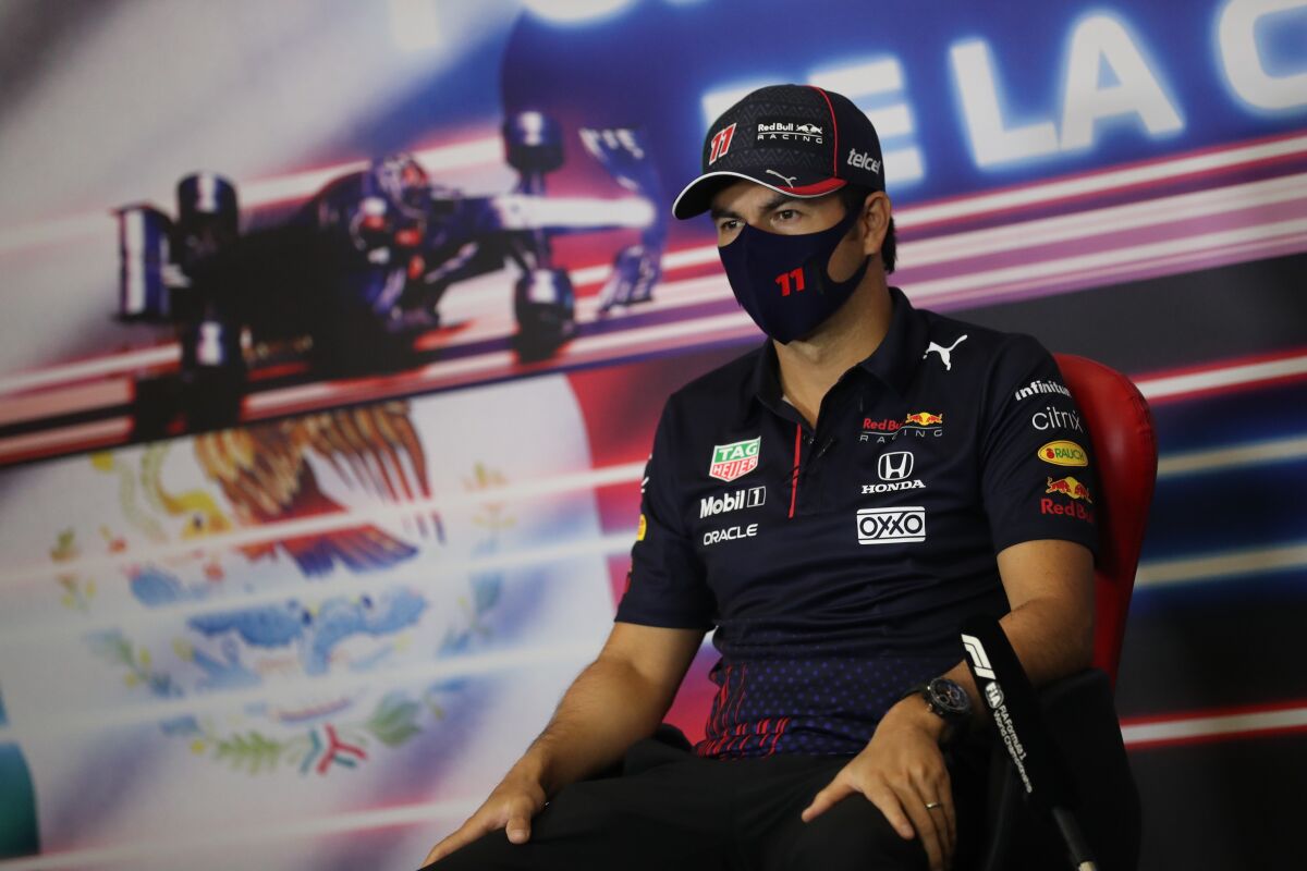 Formula One driver Sergio Perez, of Mexico, attends a press conference ahead of this weekend's Mexican Grand Prix in Mexico City, Thursday, Nov. 4, 2021. (Edgard Garrido, Pool Photo via AP)