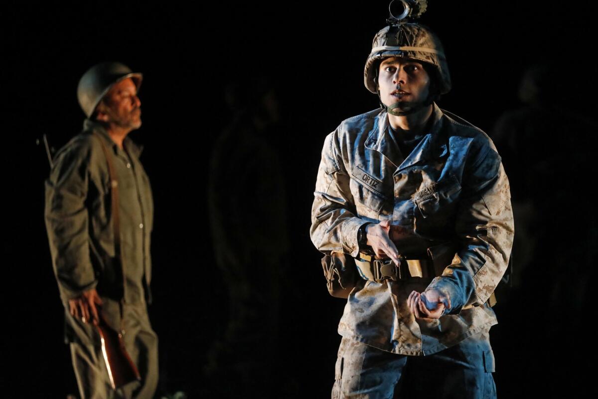 Elliot (Peter Mendoza), with Grandpop (Ruben Garfias) in the shadows behind him, in "Elliot, A Solider's Fugue."