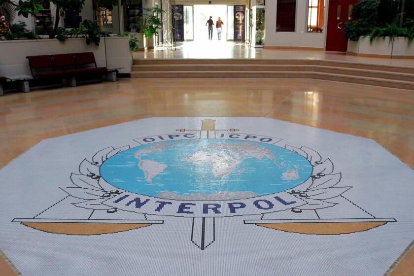 FILE - This Oct.16, 2007 file photo shows the entrance hall of Interpol's headquarters in Lyon, central France. International police agency Interpol has voted Wednesday Sept.27, 2017 to include the "State of Palestine" as a member, in a new boost to Palestinian efforts for international recognition.(AP Photo/Laurent Cipriani, File)