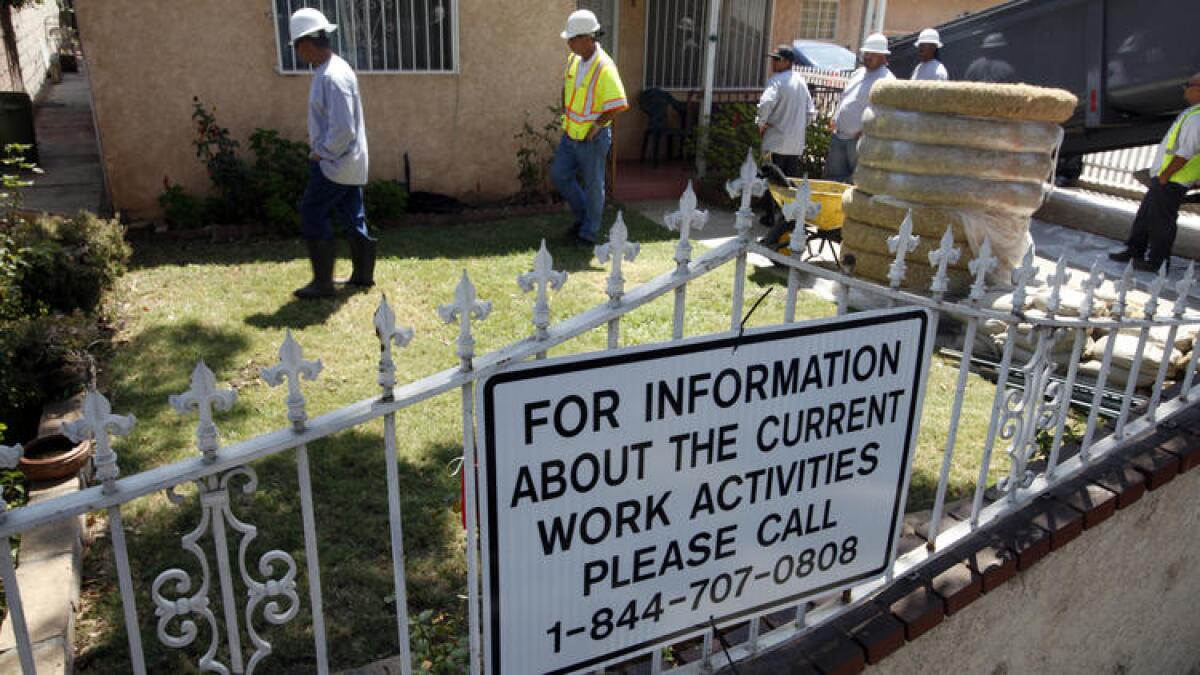 Crews work to remove lead-contaminated soil in Boyle Heights.