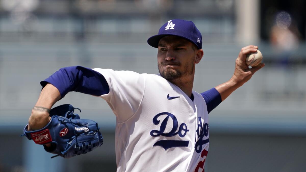 Dodgers starting pitcher Andrew Heaney throws to the plate against the Reds Sunday in Los Angeles. 