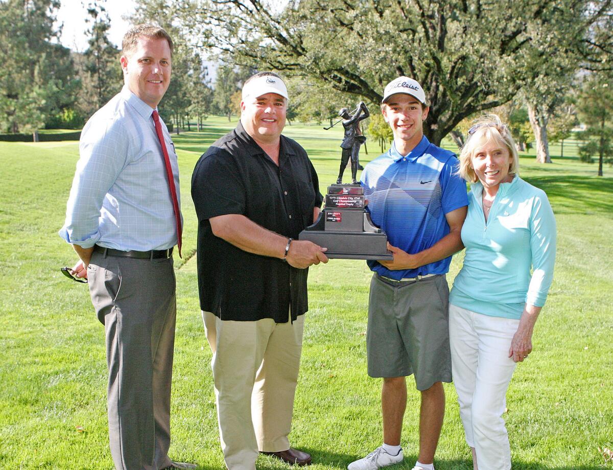 Co-chairs Kris Hons and Rick Dinger, winner Vinny De Pinto, and Dotty Sharkey, president of Glendale Parks and Open Space Foundation, with the Glendale City Championship trophy at Oakmont Country Club in Glendale on Monday, July 28, 2014.