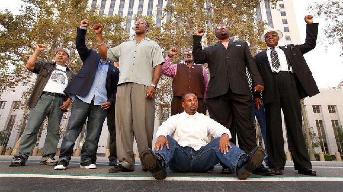 Several civil rights activists — many of whom are pictured here at an earlier call for her resignation — gathered Wednesday to announce a plan to recall Los Angeles County Dist. Atty. Jackie Lacey.