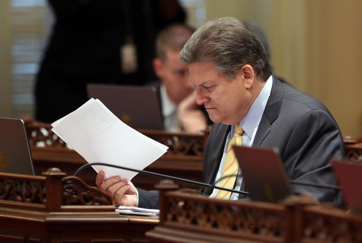 State Sen. Bob Hertzberg works at his Senate Chambers desk at the Capitol in Sacramento on April 23. A former Assembly speaker, Hertzberg returned after a 12-year hiatus with an aggressive agenda, starting with an ambitious tax overhaul.