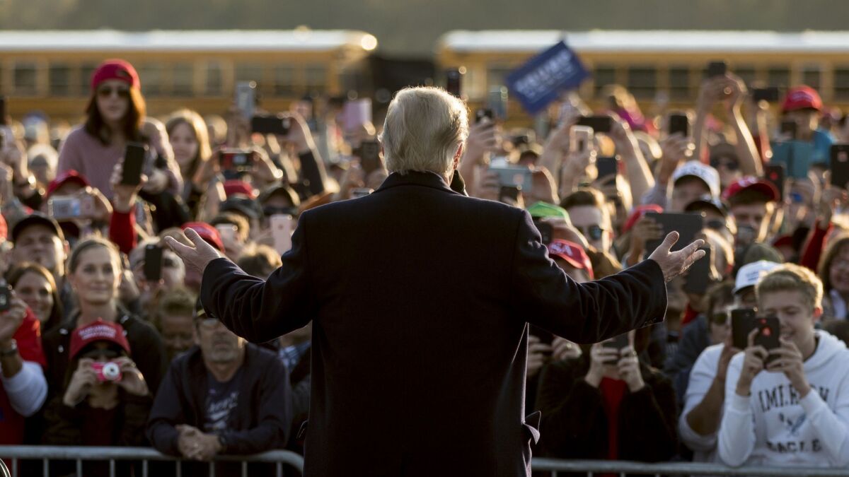 President Trump speaks to an overflow crowd at a rally at Southern Illinois Airport in Murphysboro, Ill. on Oct. 27.