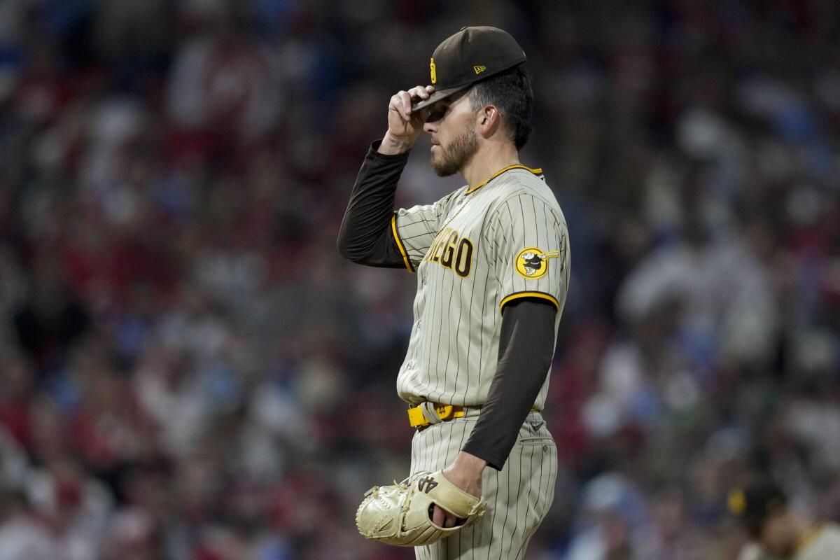 San Diego Padres starting pitcher Joe Musgrove reacts after giving up a two-run single to Philadelphia's Jean Segura.