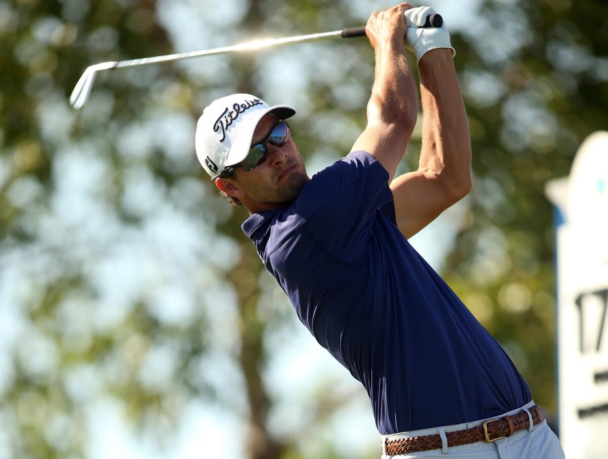 Adam Scott tees off on the 17th hole during the final round of the Barclays at Liberty National Golf Club on Sunday.