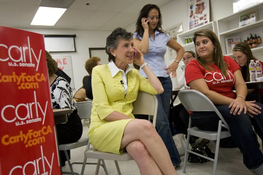 GOP Senate candidate Carly Fiorina makes a stop in San Diego to take calls alongside volunteers working at her campaign phone bank in Sorrento Mesa. With the former Hewlett-Packard CEO on Friday were Rebecca Risty (center) and Lizzy Blumberg.