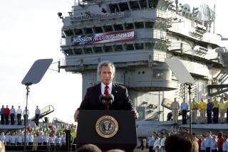 FILE - President George W. Bush speaks aboard the aircraft carrier USS Abraham Lincoln off the California coast on May 1, 2003. (AP Photo/J. Scott Applewhite, File)