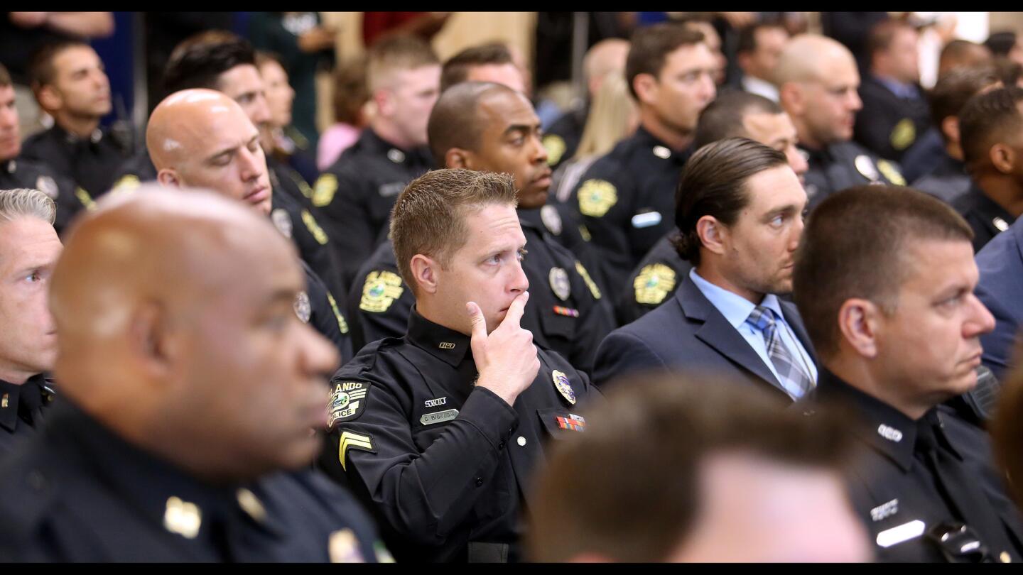 Orlando Police SWAT team members and officers listen to police chief John Mina deliver remarks during a ceremony honoring the officers and staff involved in the response to the Pulse nightclub massacre, Thursday, May 4, 2017. (Joe Burbank/Orlando Sentinel) 2707770