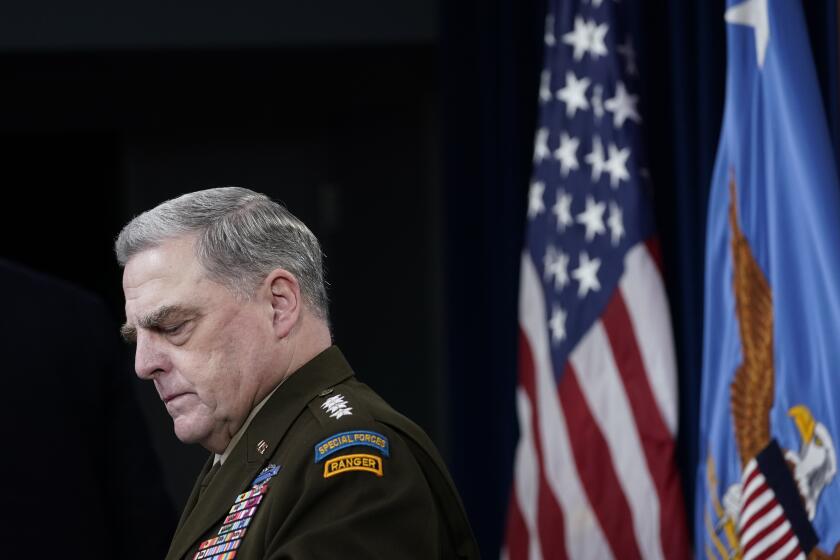 Joint Chiefs of Staff Gen. Mark Milley listens during a briefing with Secretary of Defense Lloyd Austin at the Pentagon.