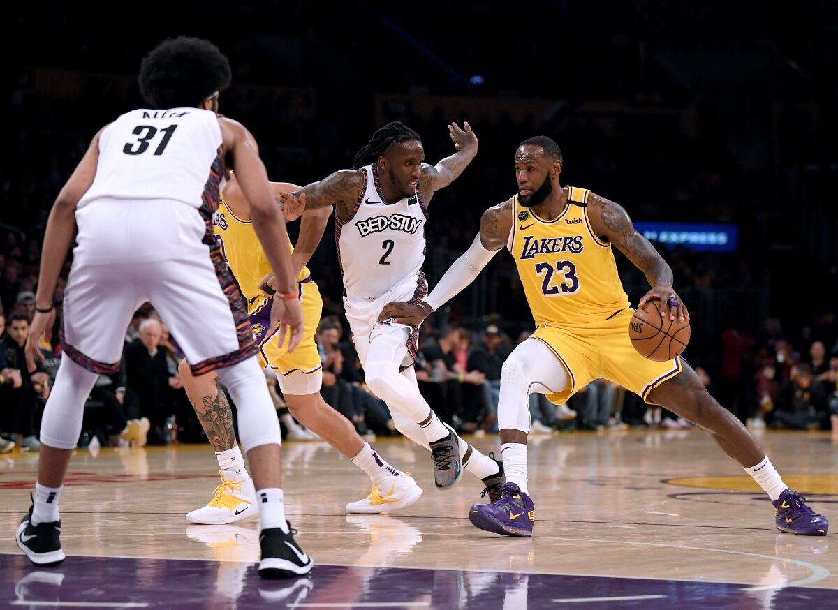 Lakers forward LeBron James drives against the Nets on March 10, 2020, during both teams' final game before suspension of play in the NBA.