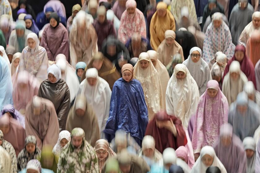 Indonesian Muslims attend an evening prayer called 'tarawih' to mark the first eve of the holy fasting month of Ramadan, at Istiqlal Mosque in Jakarta, Indonesia, Monday, March 11, 2024. (AP Photo/Dita Alangkara)