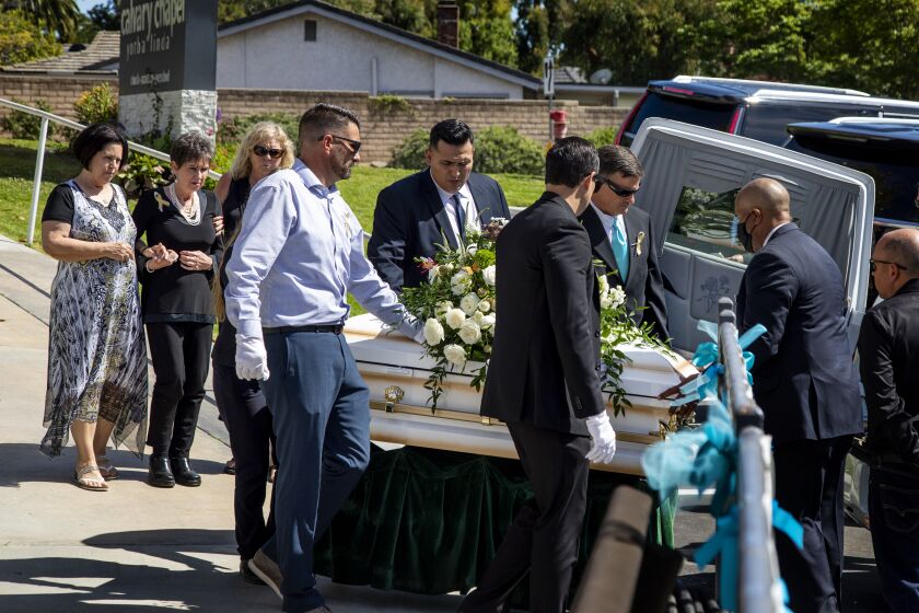 YORBA LINDA, CA - JUNE 5, 2021: Family members walk behind pallbearers carrying the casket of 6-year-old Aiden Leos after a funeral service at Calvary Chapel Yorba Linda on June 5, 2021 in Yorba Linda, California. Aiden was tragically killed while riding in his mom's car when someone fired a gun at the car on the 55 freeway in what is being called a road rage incident.(Gina Ferazzi / Los Angeles Times)