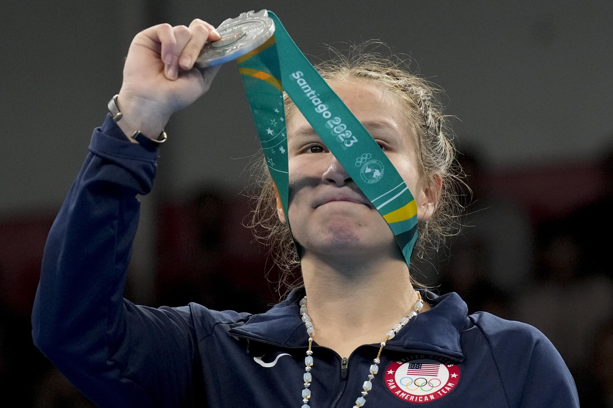 U.S. boxer Jennifer Lozano holds up her medal after her trumph at the Pan American Games in October 2023.