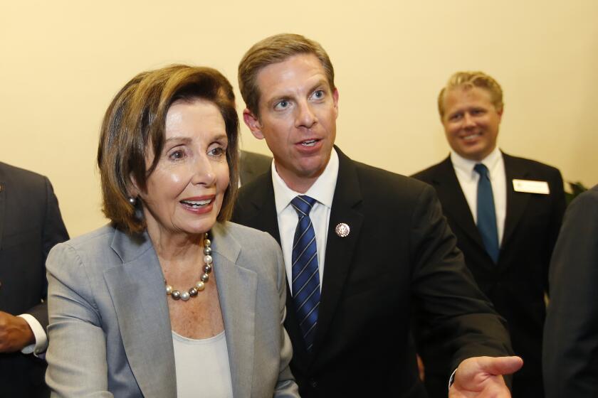 House Speaker Nancy Pelosi greeted supporters after speaking with Rep. Mike Levin, right, at community event in Oceanside on Nov. 4, 2019.