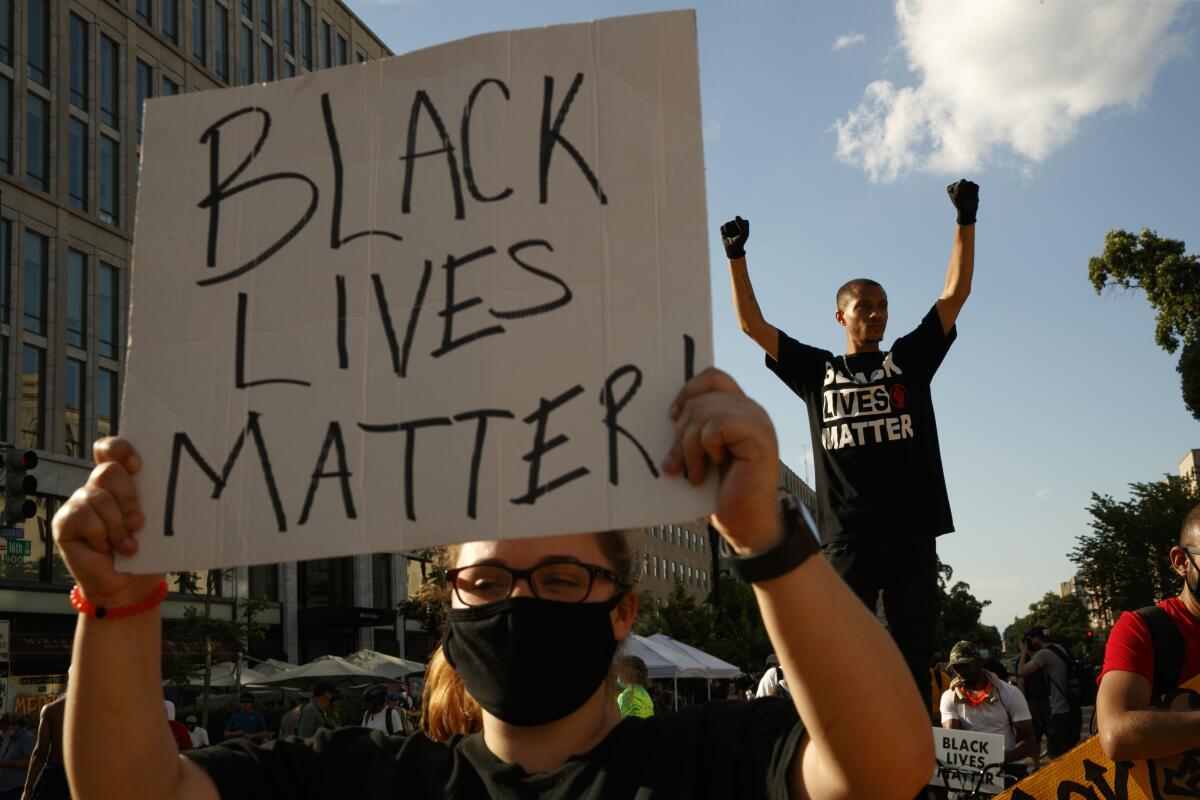 Protester with "Black Lives Matter" sign
