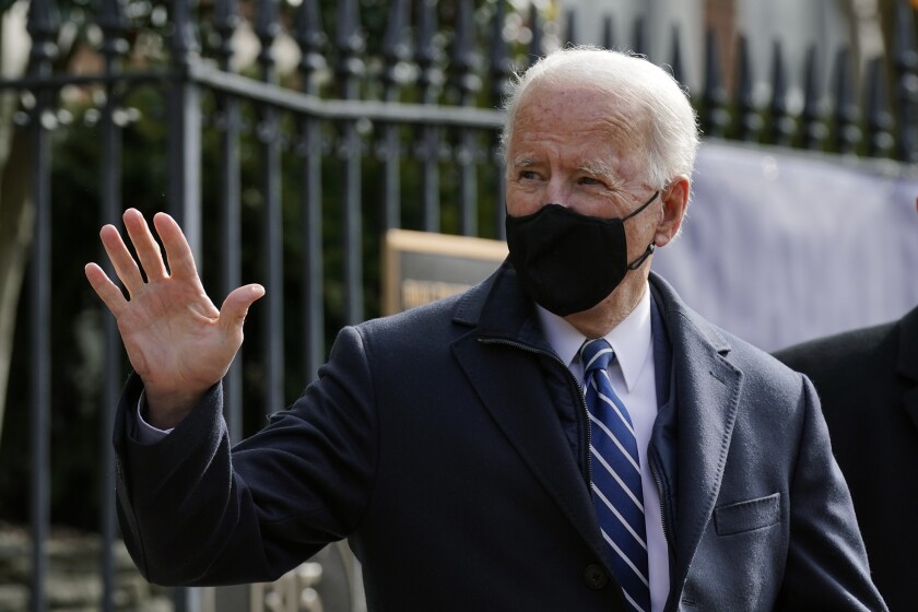 President Biden waves as he leaves Holy Trinity Catholic Church in Washington after attending Mass.