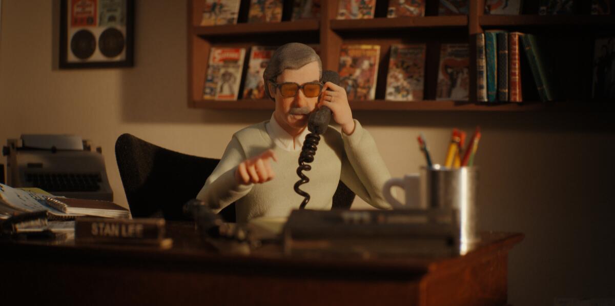 A plastic figurine of Stan Lee talks on the phone in the documentary "Stan Lee."
