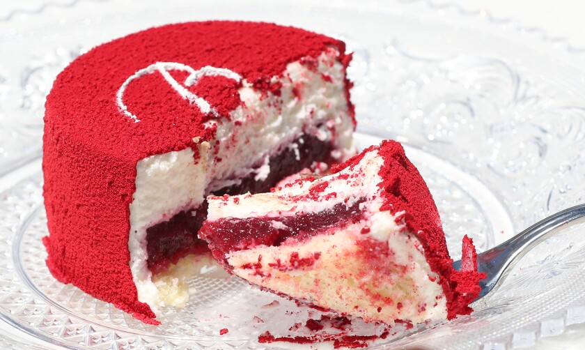 A strawberry velvet cake features the Baccarat logo.