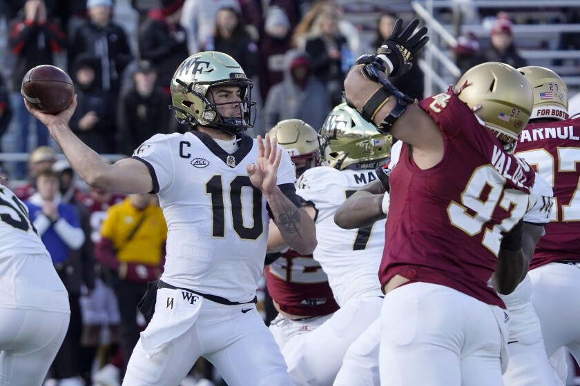 Wake Forest quarterback Sam Hartman (10) passes against Boston College on Nov. 27, 2021.