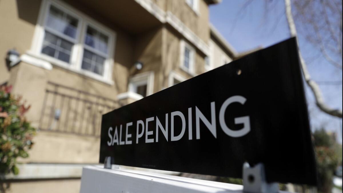 A sign advertises the pending sale of a home in San Jose.