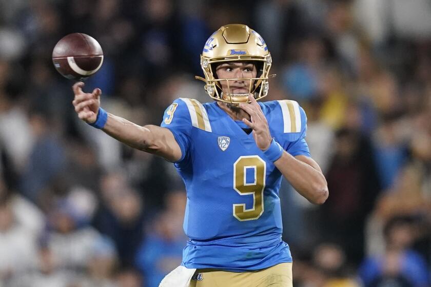 UCLA quarterback Collin Schlee throws a pass against Arizona State during the first half of an NCAA college football game Saturday, Nov. 11, 2023, in Pasadena, Calif. (AP Photo/Ryan Sun)