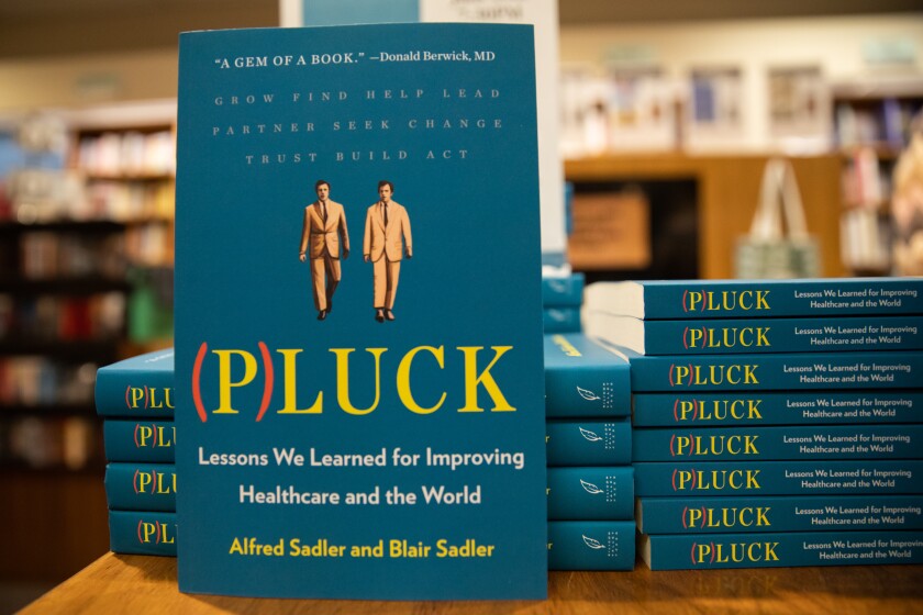 Stacks of the new book (P)LUCK by twin brothers Blair Sadler Alfred Sadler at Warwick's Bookstore San Diego.