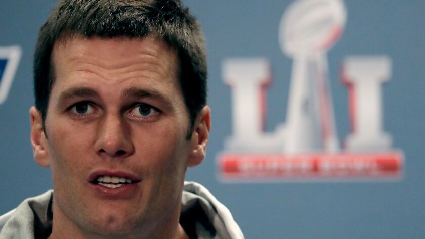 New England Patriots quarterback Tom Brady talks to reporters in advance of the Super Bowl on Feb. 2 in Houston.