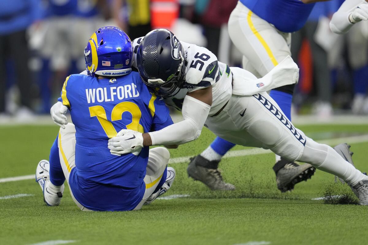 Rams quarterback John Wolford is sacked by Seattle Seahawks linebacker Jordyn Brooks during the second half.