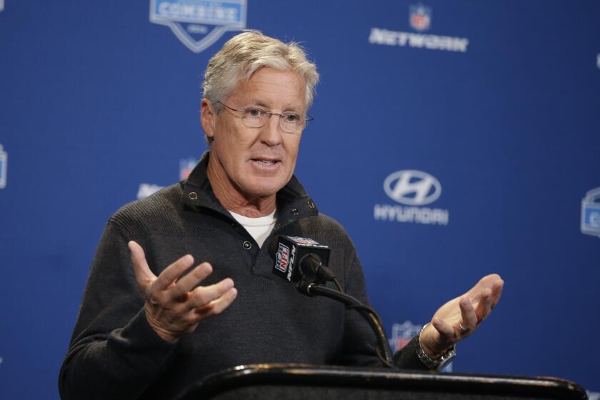 Seattle Seahawks Coach Pete Carroll responds to a question during a news conference at the NFL scouting combine Thursday.