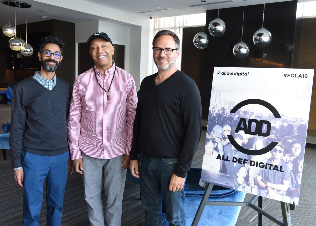 From left, All Def Digital President and chief executive Sanjay Sharma, founder Russell Simmons and ADHD Managing Director Josh Mandel at a conference in L.A. in May.