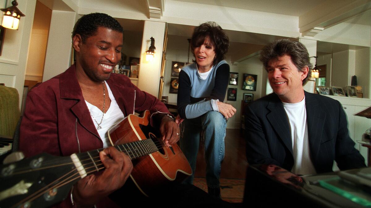 Sager with Kenny "Babyface" Edmonds, left, and David Foster in 2000.