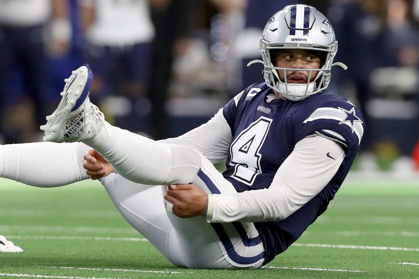 ARLINGTON, TEXAS - DECEMBER 15: Dak Prescott #4 of the Dallas Cowboys reacts after being knocked to the turf against the Los Angeles Rams in the first half at AT&T Stadium on December 15, 2019 in Arlington, Texas. (Photo by Tom Pennington/Getty Images/TNS) ** OUTS - ELSENT, FPG, TCN - OUTS **