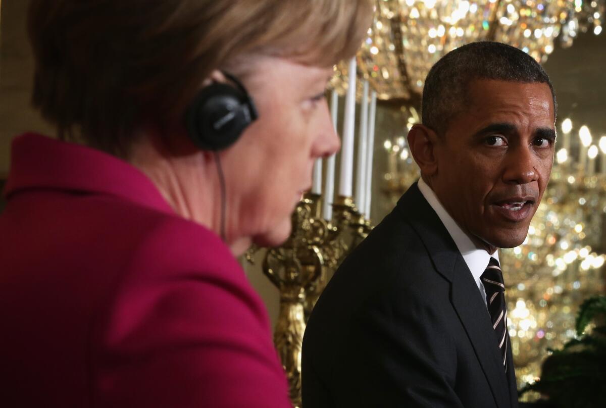 German Chancellor Angela Merkel, left, and President Obama hold a joint news conference after meetings about the situation in Ukraine.