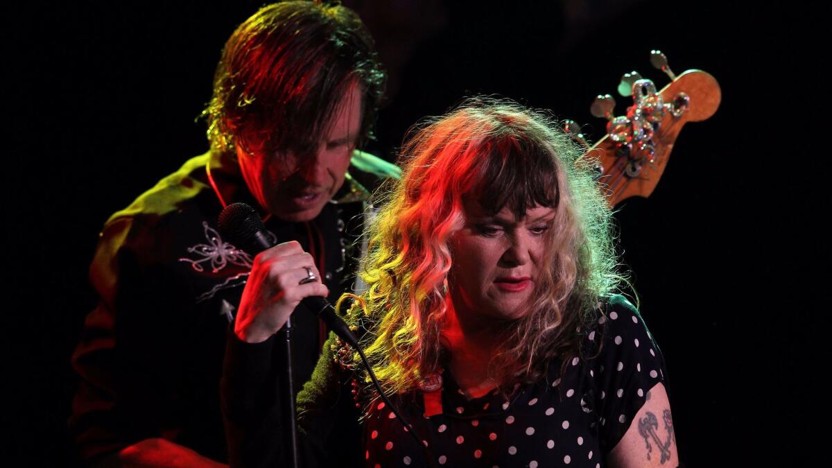 X's John Doe and Exene Cervenka, shown during a 2014 performance in West Hollywood, will be saluted along with longtime bandmates Billy Zoom and DJ Bonebrake during the Dodgers' Aug. 16 game with the Chicago White Sox.