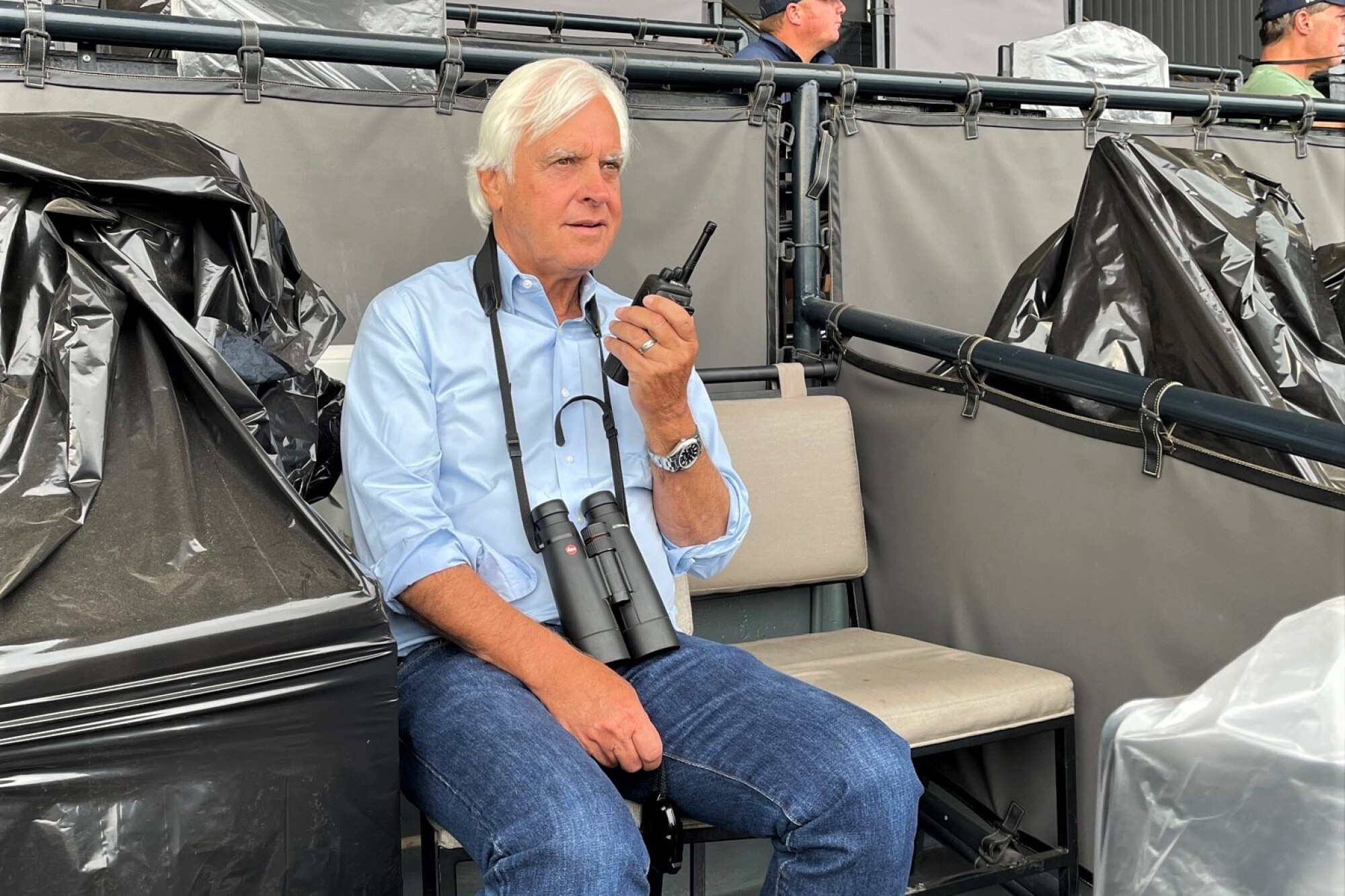 Trainer Bob Baffert watches a morning workout at Santa Anita Park.