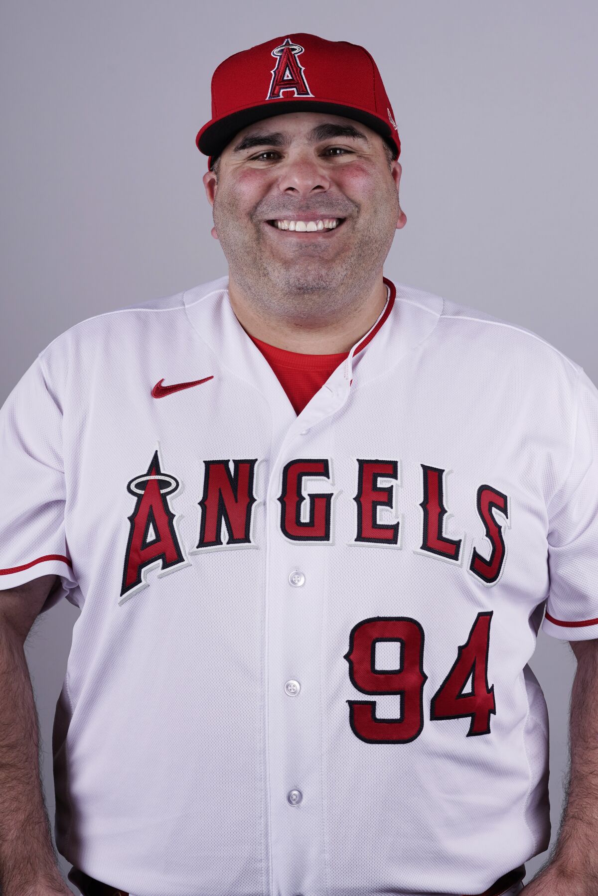 Ali Modami smiles in an Angels uniform.