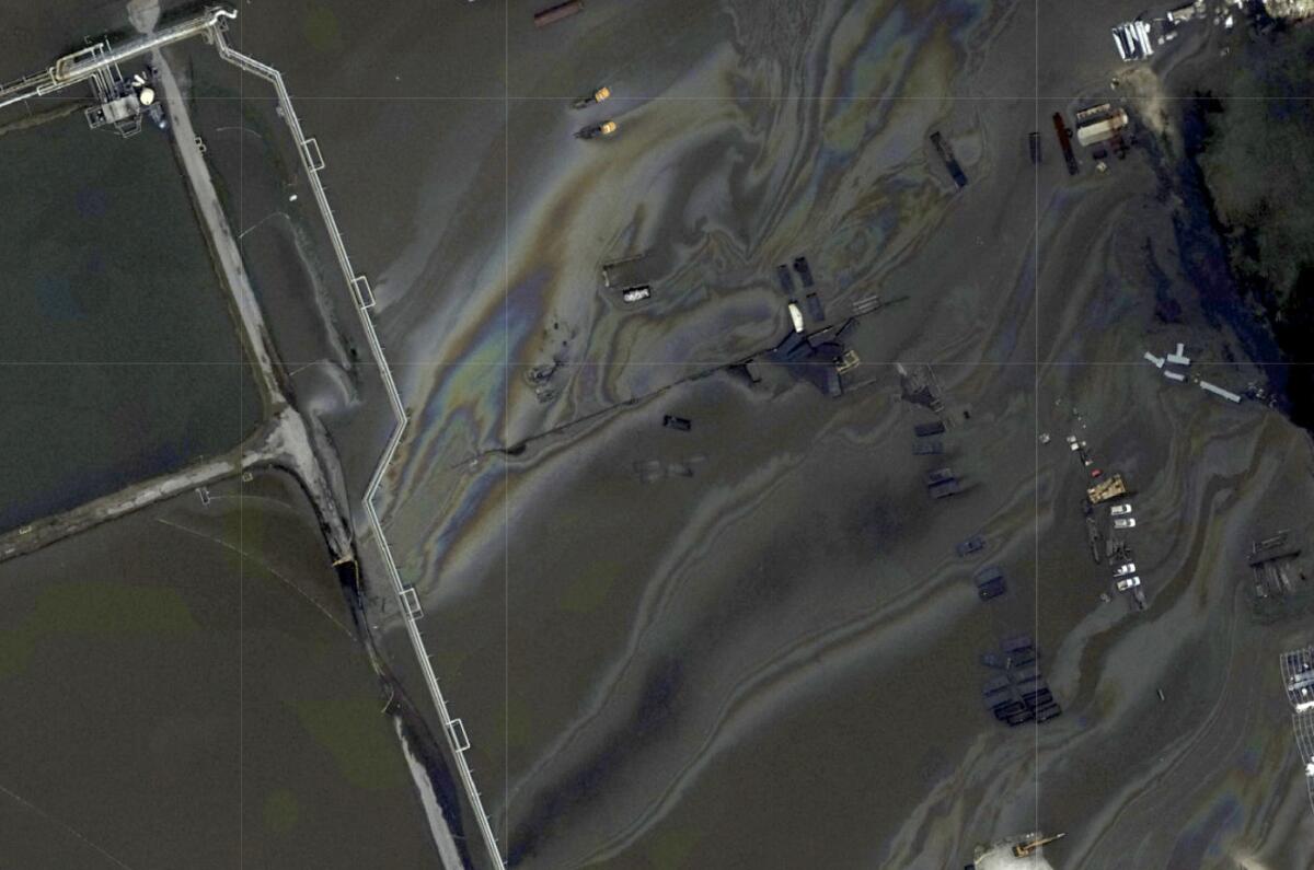This image provided by NOAA shows a long black slick floating in the Gulf of Mexico. The U.S. Coast Guard says it is investigating reports of possible oil spills resulting from Hurricane Ida after the publication of aerial photos by The Associated Press. Coast Guard spokesman Petty Officer 3rd Class Gabriel Wisdom said Thursday, Sept. 2, 2021 that aircraft were being dispatched to investigate reports of a miles-long slick in the Gulf of Mexico south of Port Fourchon, Louisiana. (NOAA via AP)