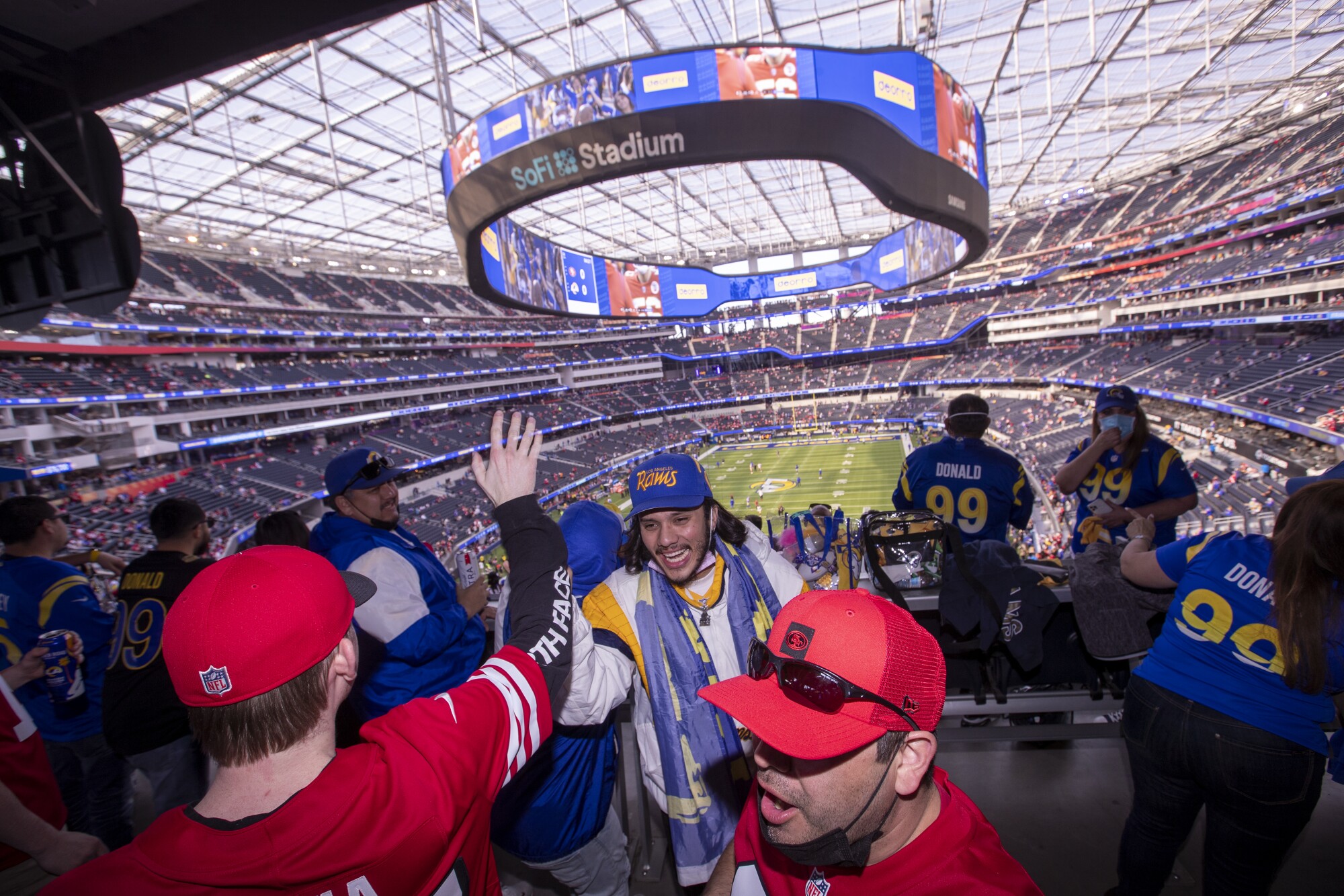 Los Angeles Rams and San Francisco 49ers fans rally together.