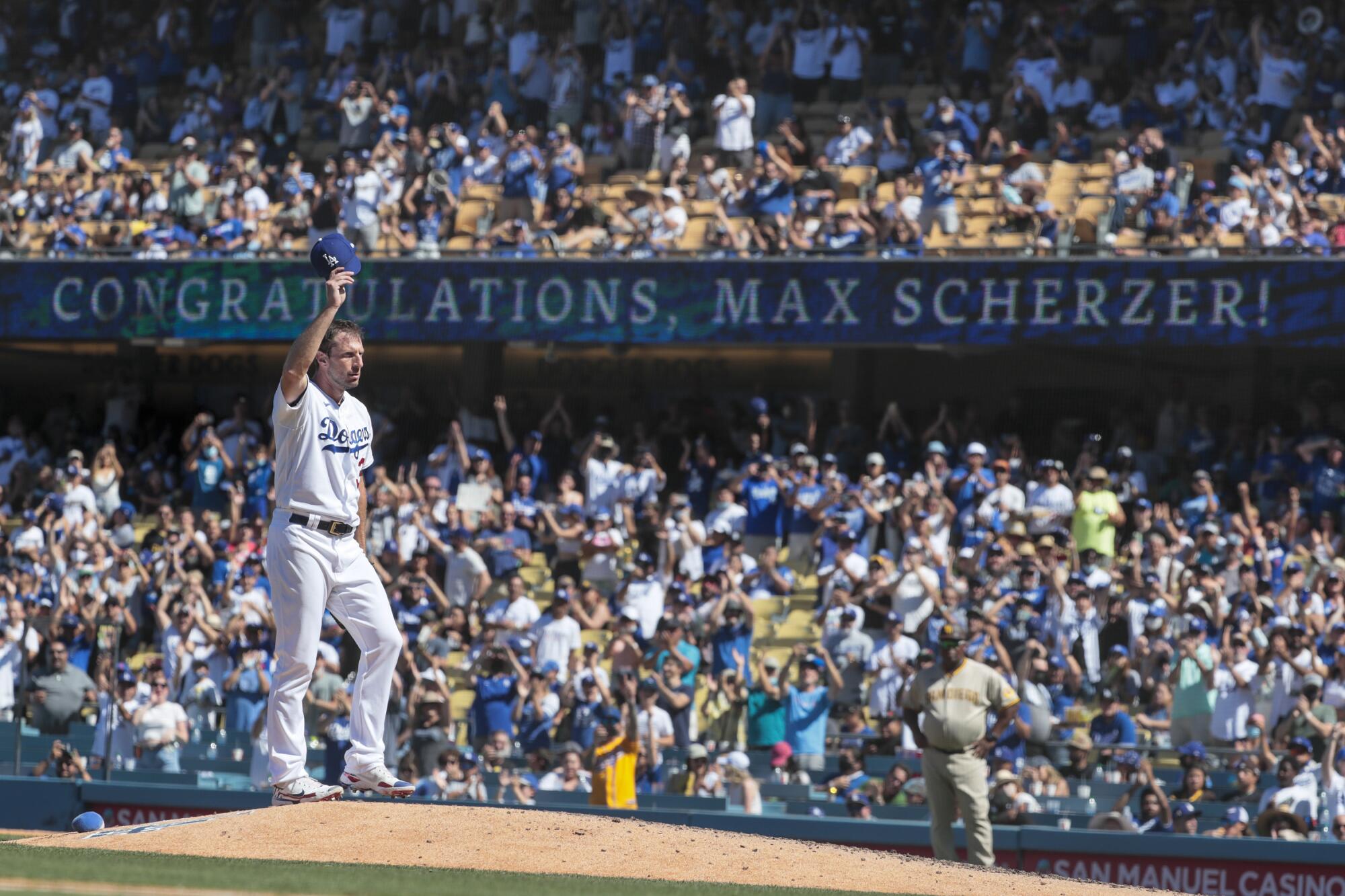 Dodgers starting pitcher Max Scherzer acknowledges a standing ovation from the fans at Dodger Stadium.