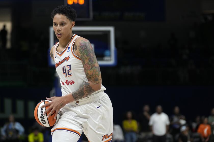 Phoenix Mercury center Brittney Griner handles the ball during a WNBA basketball game against the Dallas Wings, Wednesday, June 7, 2023, in Arlington, Texas. (AP Photo/Tony Gutierrez)