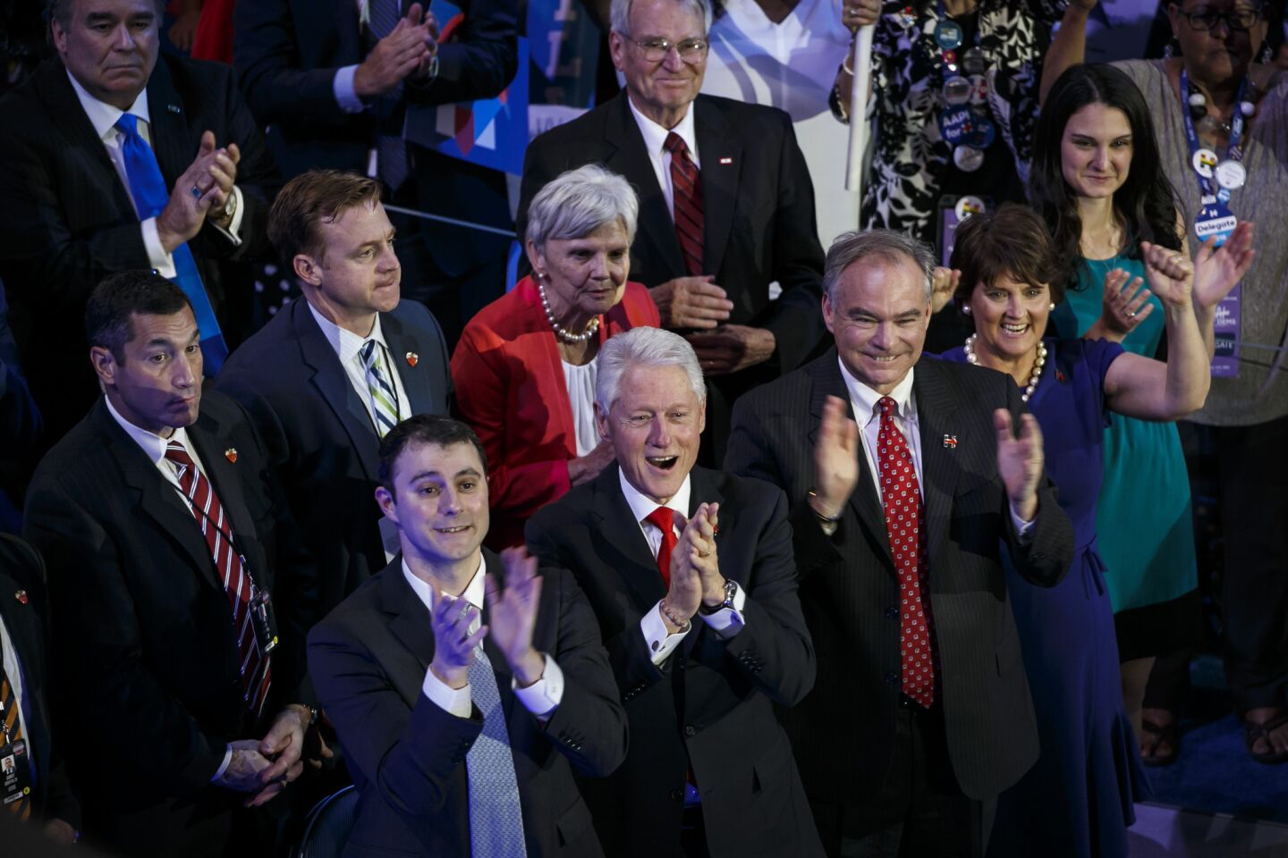 Marc Mezvinsky, from left, President Bill Clinton, Senator Tim Kaine, and Anne Holton watch a video about Hillary Clinton at the 2016 Democratic National Convention.