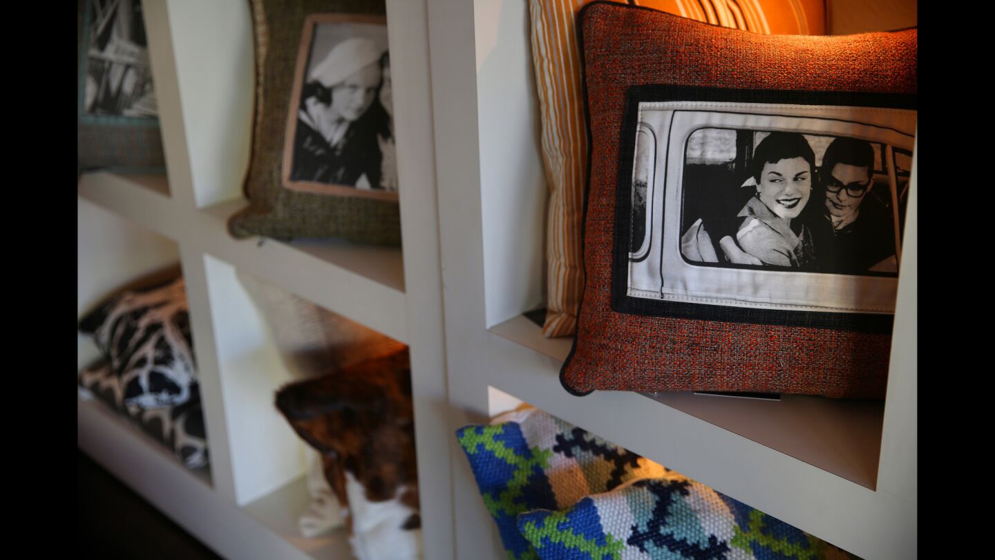 "Love Is for All" pillows, part of the Trebor/Nevets private-label collection, are on display at the shop. The pillows are made of a mixture of vintage and new fabrics with reproduced photographs of couples.