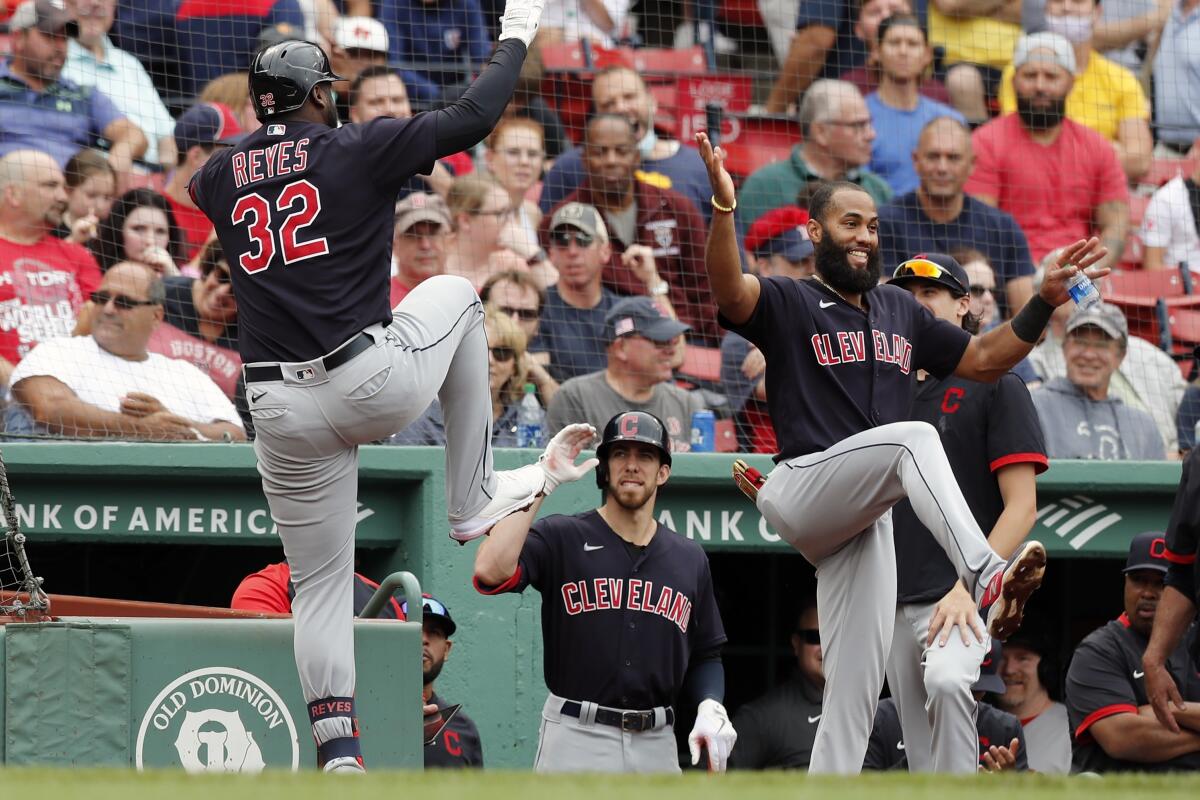 Cleveland Indians' Franmil Reyes (32) celebrates his solo home run during the third inning of a baseball game against the Boston Red Sox, Sunday, Sept. 5, 2021, in Boston. (AP Photo/Michael Dwyer)
