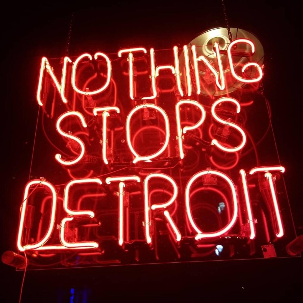 A sign declaring "Nothing stops Detroit" hangs in a storefront along Woodward Avenue in downtown Detroit, one of many signs and murals aimed at lifting the spirits of locals in the economically depressed city.