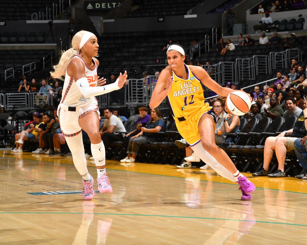 Rae Burrell of the Sparks goes to the basket against Connecticut on Tuesday at Crypto.com Arena.