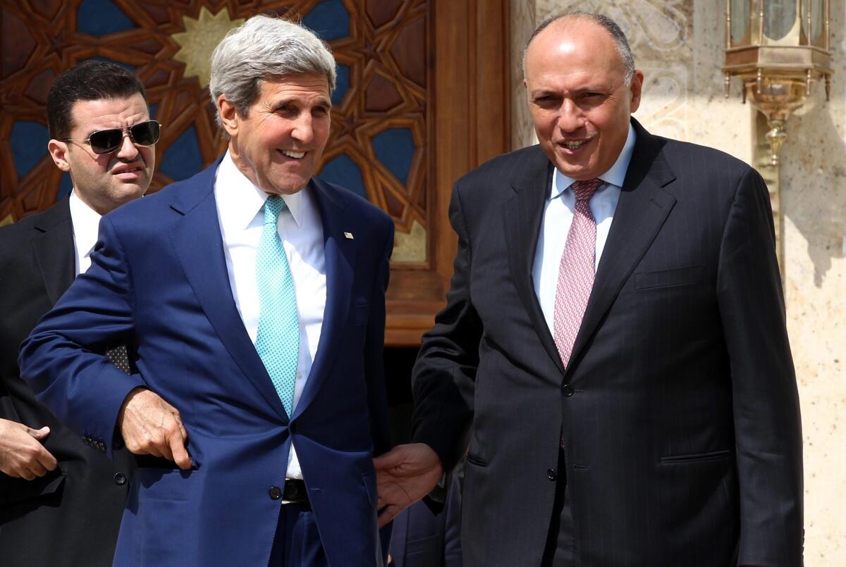 Secretary of State John F. Kerry, left, and Egyptian Foreign Minister Sameh Shoukry talk after their press conference following a meeting with Egyptian President Abdel Fattah Sissi in Cairo on Tuesday.