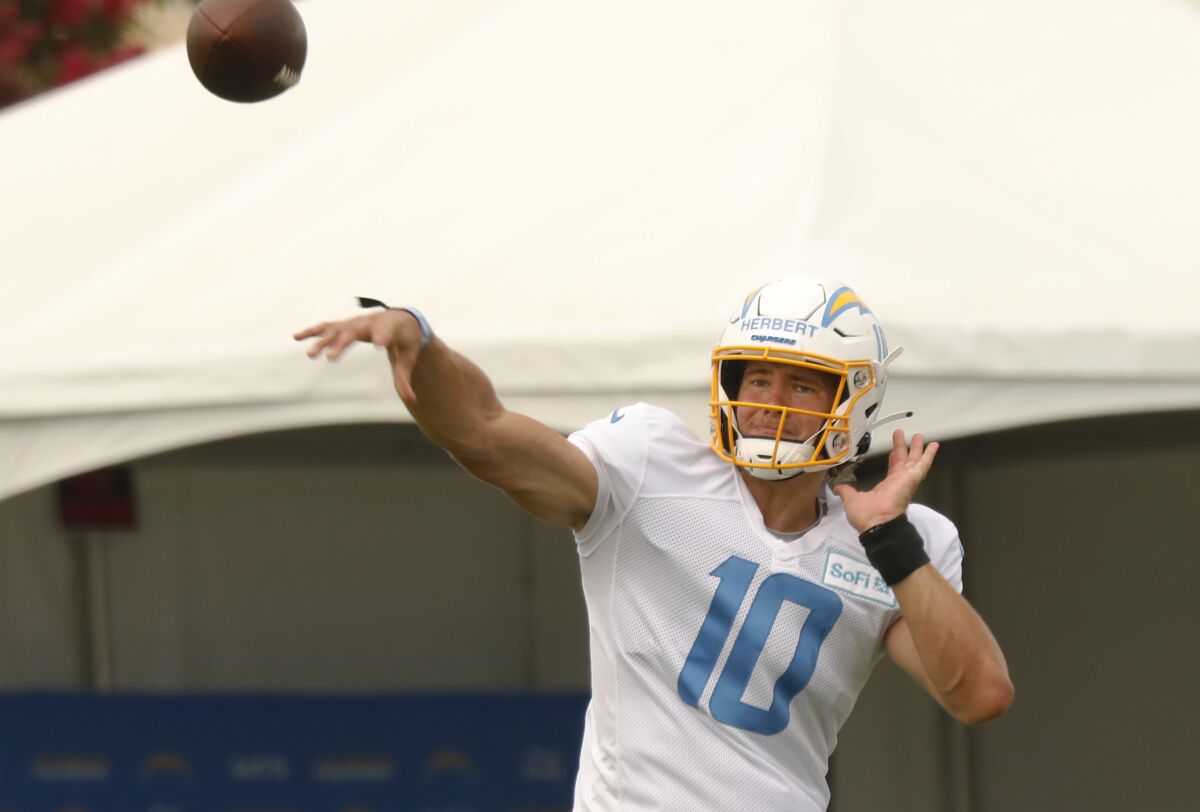 Chargers quarterback Justin Herbert throws a pass during practice in Costa Mesa on Monday.